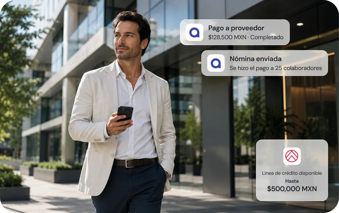 Empresario consultando su celular frente a un edificio corporativo